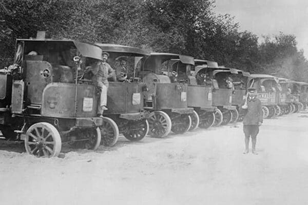 A Fleet of Trucks each with its own Driver is arrayed and ready to transport troops. - Art Print