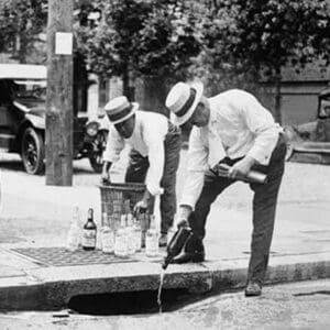 Agents Pouring liquor down a sewer on the Street - Art Print