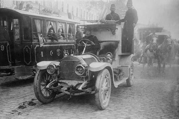 Armored Automobile juxtaposed with Trolley Car & Horse Team on a City Street in Turkey - Art Print