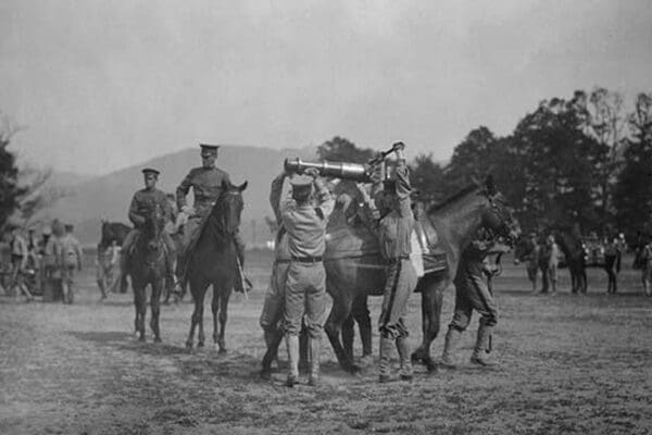 Army Cadets Lift Large Artillery Piece from a Horse - Art Print