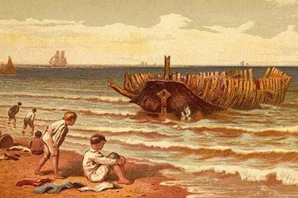 Childen play on the beach near the hulk of a wrecked boat with its ribs exposed by Kronheim & Dalziels - Art Print