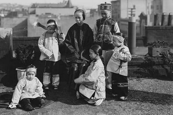 Chinese Mother with her children in Native Costume sit on rooftop by Jackson - Art Print