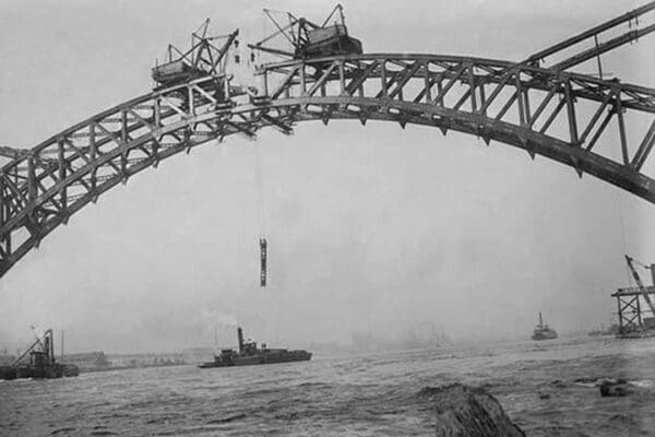 Completing the Hell Gate Railroad Bridge over the East River connecting Queens with Manhattan - Art Print