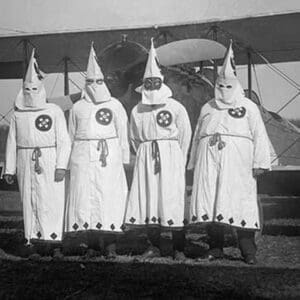 Four Hooded White Sheeted Ku Klux Klan Member pose in Robes & Hoods in front of Airplane - Art Print