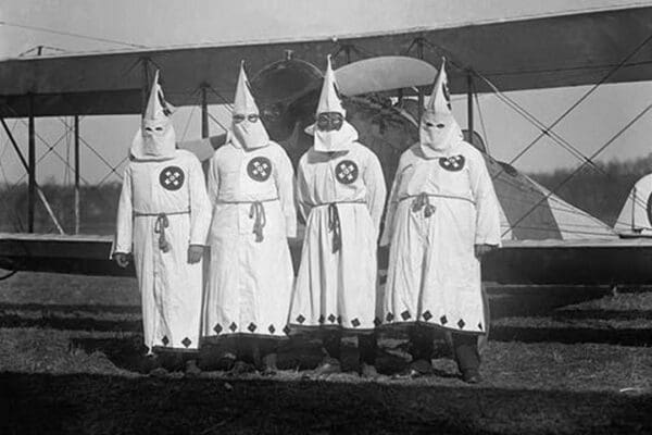 Four Hooded White Sheeted Ku Klux Klan Member pose in Robes & Hoods in front of Airplane - Art Print