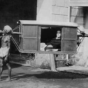 Four Indian Porters Carry a Westerner in a palanquin or Sedan Chair - Art Print