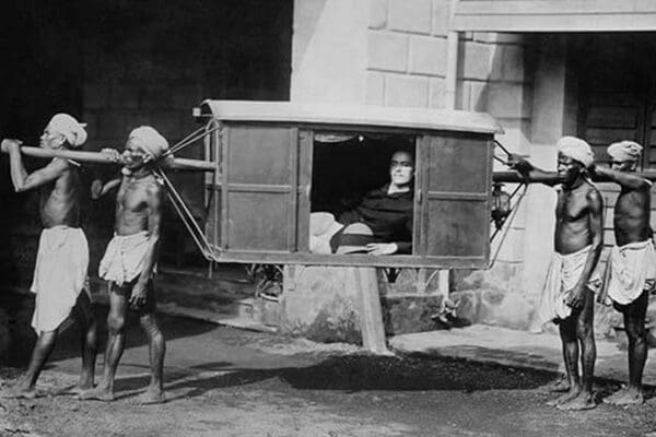 Four Indian Porters Carry a Westerner in a palanquin or Sedan Chair - Art Print