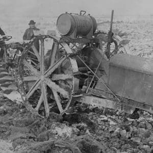 German Designed Huge Tractor digs for unearths potatoes. - Art Print