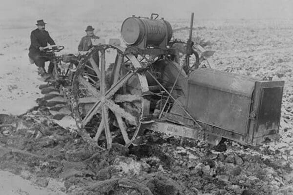 German Designed Huge Tractor digs for unearths potatoes. - Art Print