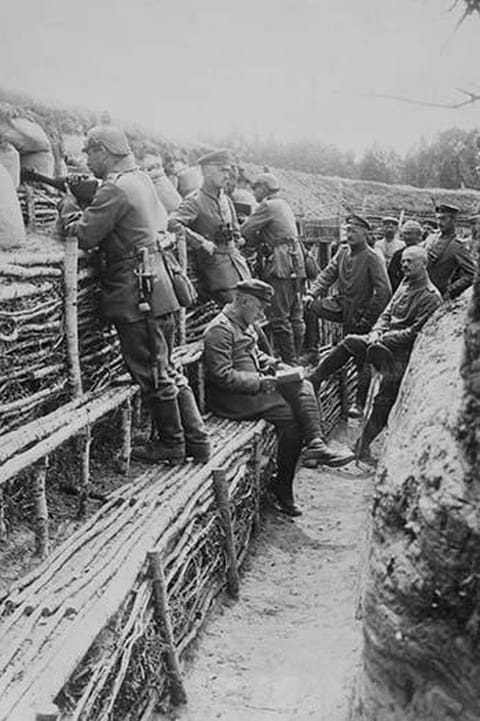 German Soldiers relax in their deep trenches which in the Stalemates of WWI have become a home. - Art Print