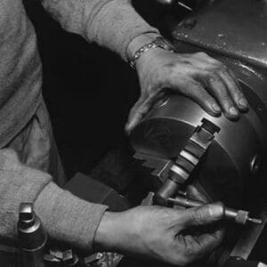 Hands of lathe worker by Ansel Adams - Art Print