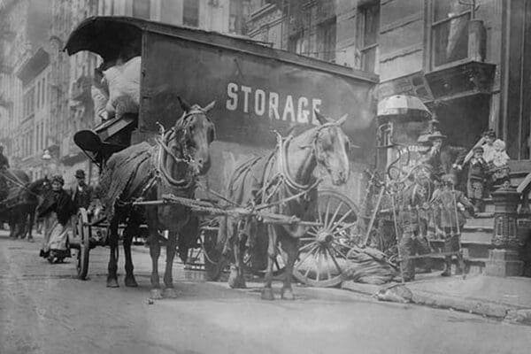 Horse Drawn Wagon with sign saying STORAGE unload the home content of a family being evicted - Art Print