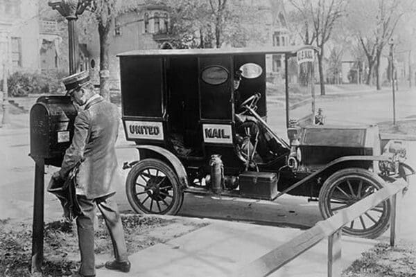 Mailman at Post Box with his truck parked at the curb - Art Print