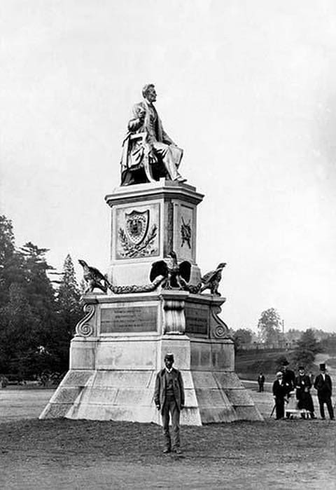 Man Standing in Front of Lincoln Statue