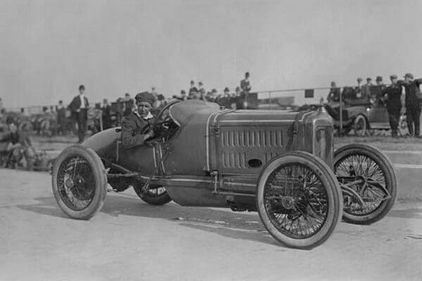 Maxwell Racing Car driven by Jack McKay as onlookers watch from behind barrier - Art Print