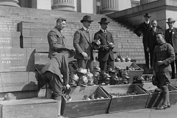 Men unload Prussian Helmets - Art Print