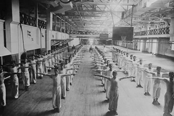 Naval Cadets exercise in large hangar in their calisthenics - Art Print