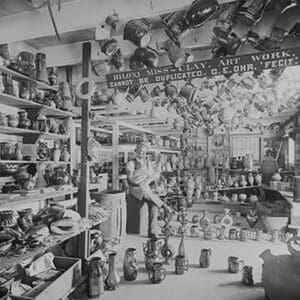 Owner sits in Retail Pottery Store waiting for Customers - Art Print