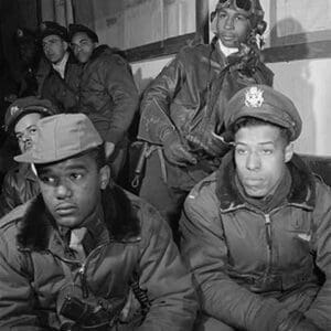 Photograph of Tuskegee airmen attending a briefing in Ramitelli