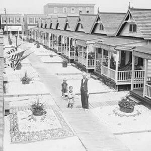 Porches and front lawns of row of bungalows