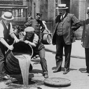 Pouring out illegal alcohol into a Sewer - Art Print