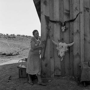 Poverty with Rife and Cattle Skulls by Dorothea Lange - Art Print