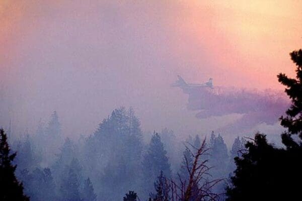 Retardent drops over Forest Fire by Bob Nichols - Art Print