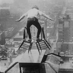 Reynolds performs a balancing act on roof in New York City - Art Print