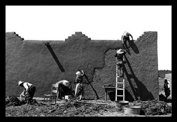 Spanish-American Women Replastering an Adobe House by Russell Lee - Art Print