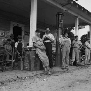 Suiting up for Baseball at the Gasoline Station by Dorothea Lange - Art Print