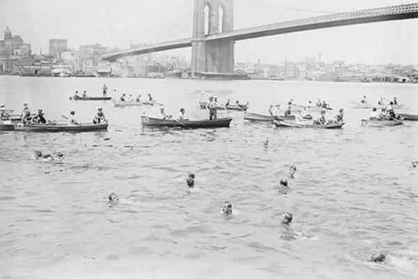 Swimmers Race to Coney Island just past the Brooklyn Bridge - Art Print