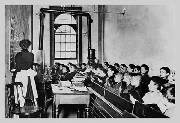 Teacher Instructs Students from Blackboard in Classroom - Art Print