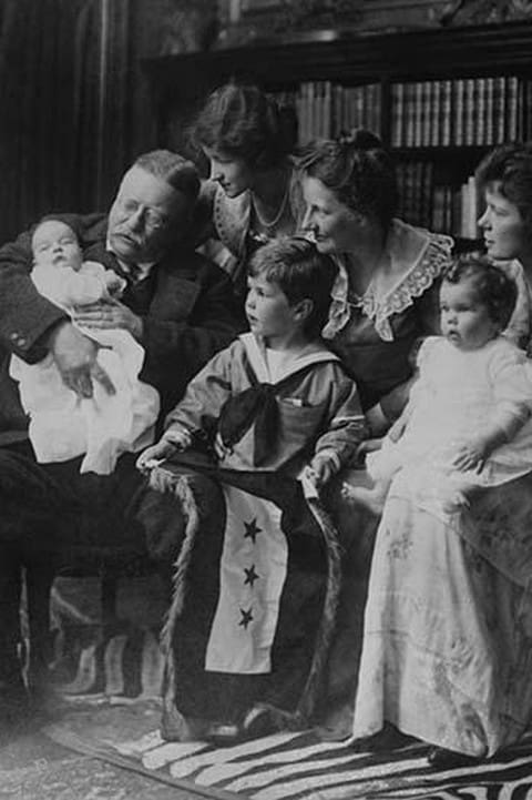 Teddy Roosevelt holds a baby in his arms in a Family Portrait - Art Print