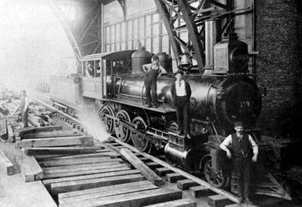 Three Men Standing On Train