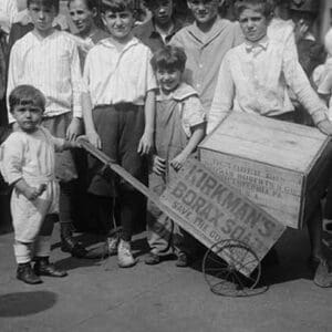 Toddler holds a small Soap Box Derby Vehicle - Art Print