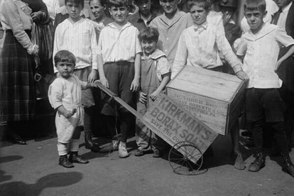 Toddler holds a small Soap Box Derby Vehicle - Art Print