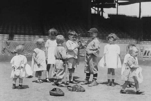 Toddlers on Baseball Field grasp a bat to select team members - Art Print