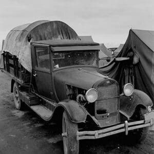 Truck Parked by Tent in FSA site by Dorothea Lange - Art Print