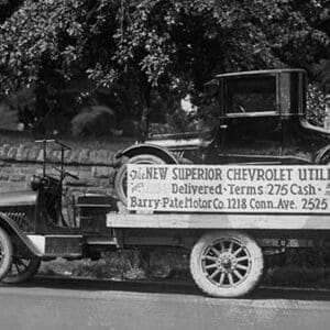 Truck carries a Chevrolet Coupe Advertisement with an actual vehicle on board - Art Print