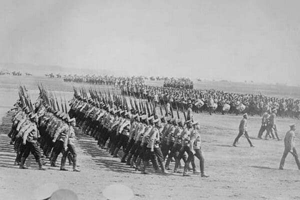 Tsarist Troops parade and pass in Review in Formation across field while a marching band plays - Art Print