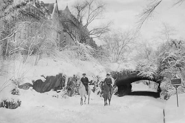 Two Horseback Riding during a Snowfall in Manhattan's Central Park - Art Print