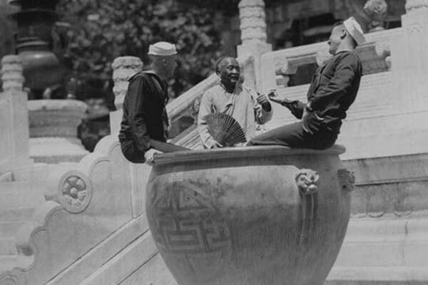 U.S. Navy Sailors on Shore Leave in Beijing frolic in Giant Ceramic Pot with Guide - Art Print