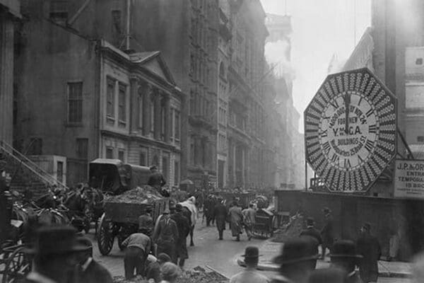 Wagons trundle along Manhattan Streets past a YMCA clock sign - Art Print